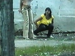 a couple of shameless birds pissing in the street in broad daylight