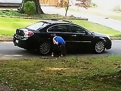 Girl caught on voyeur cam pissing on the car wheel