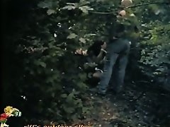 A couple hiding in vain in the woods to take a piss voyeur video