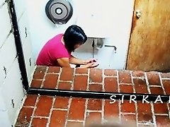 Black haired chubby girl taking a piss and blowing her nose
